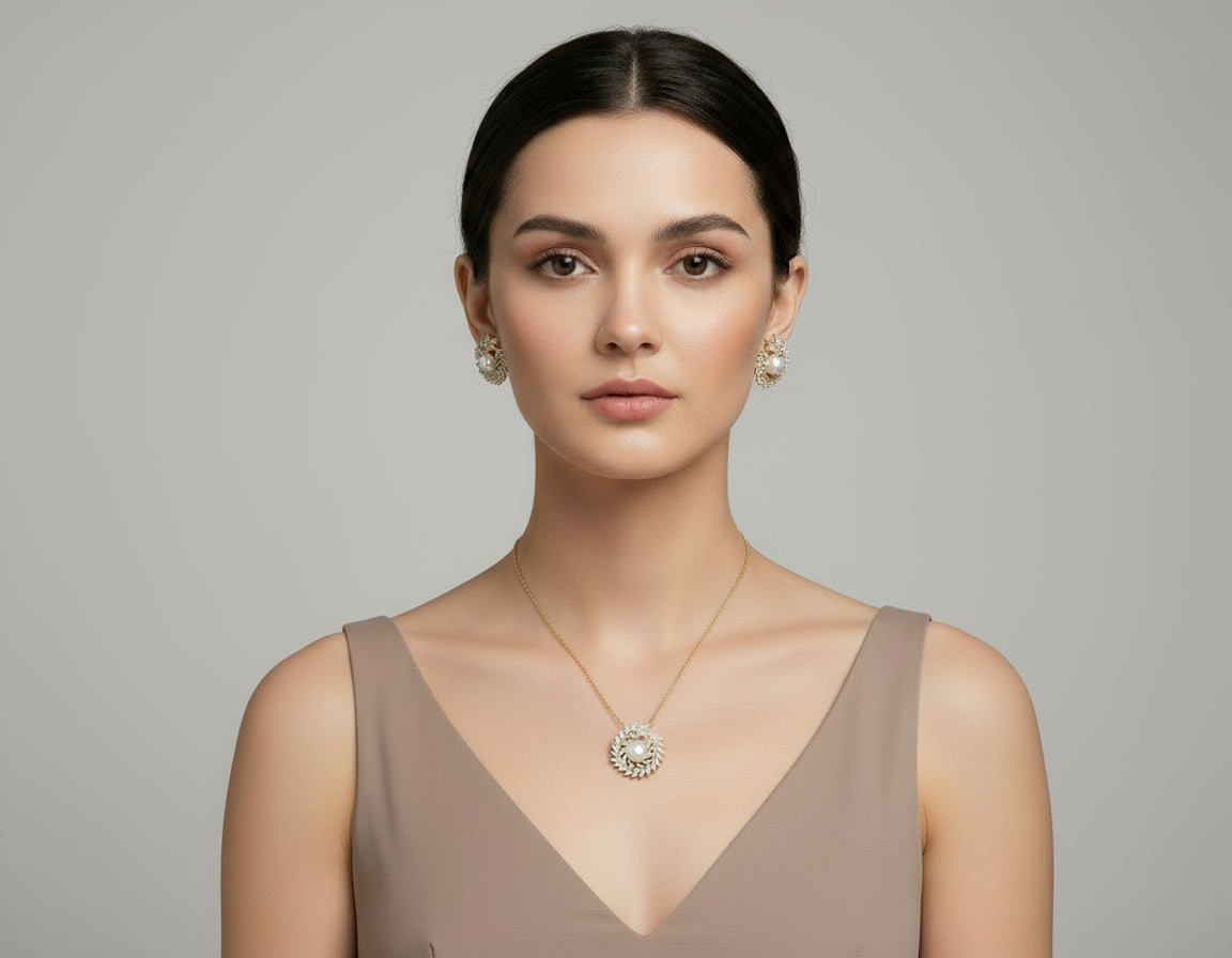 Gold and silver jewelry set with pearls on a white background