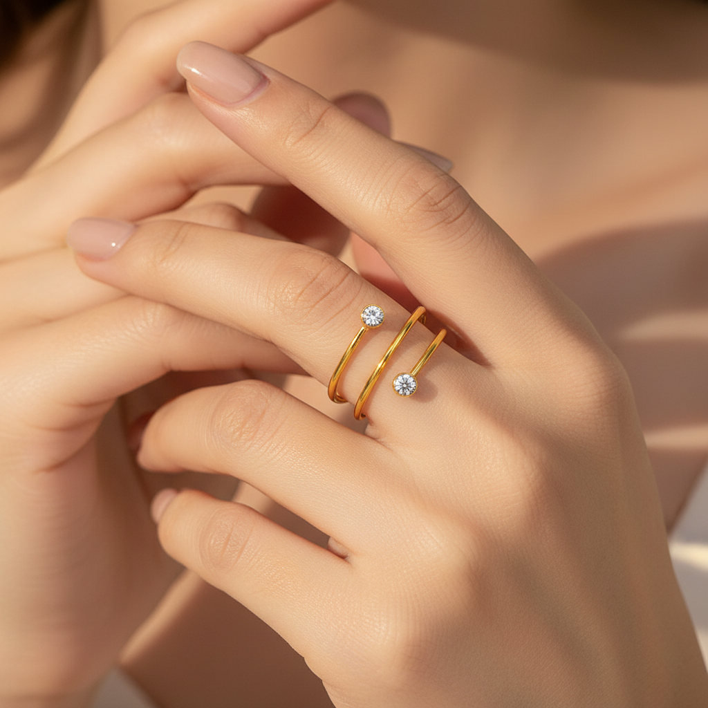 Model wearing a gold double spiral crystal ring on hand